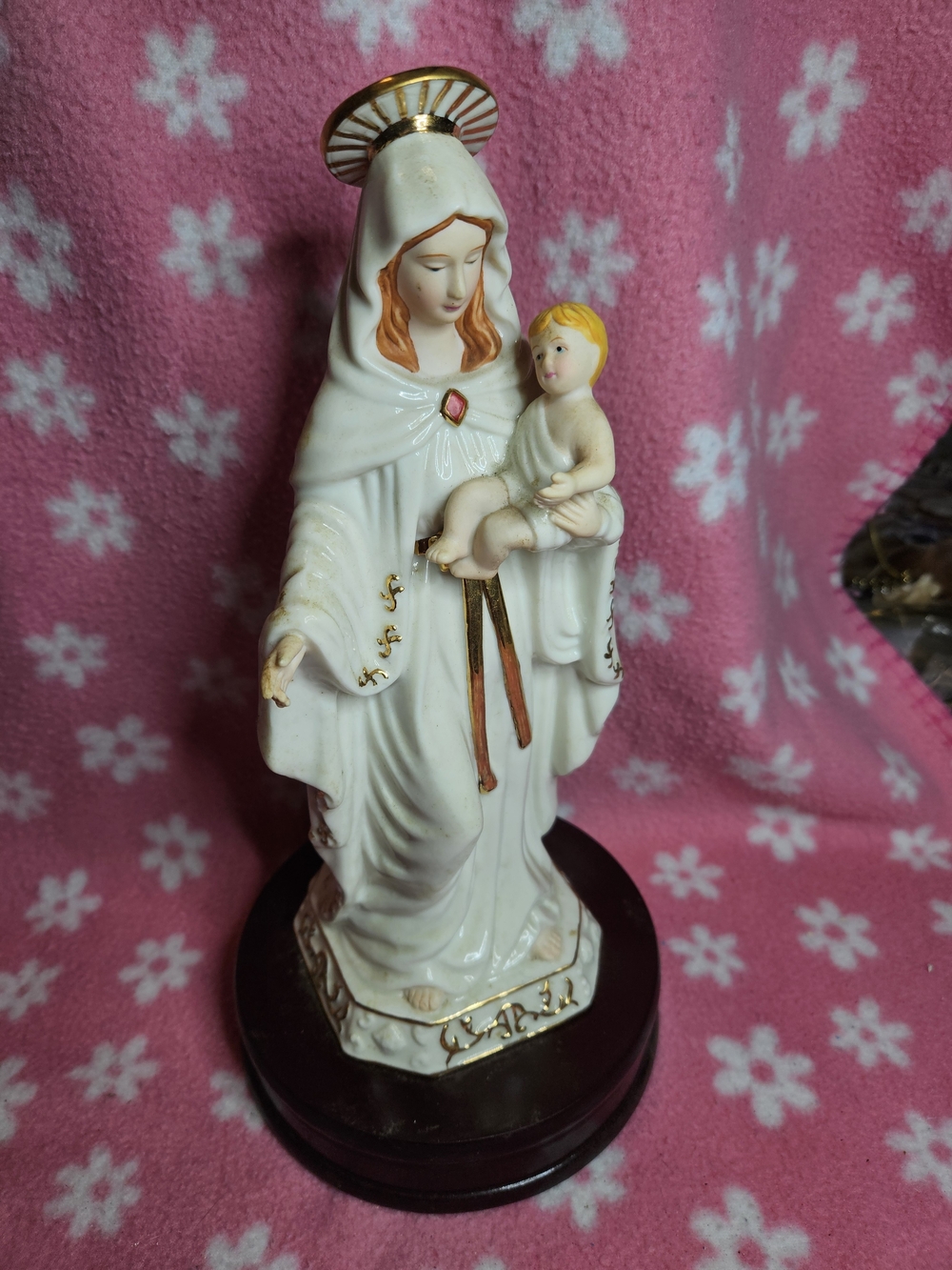 a vintage porcelain Madonna and Child music box